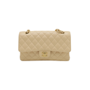 Chanel Medium Classic Double Flap bag crafted from caviar leather with beige gold-tone hardware