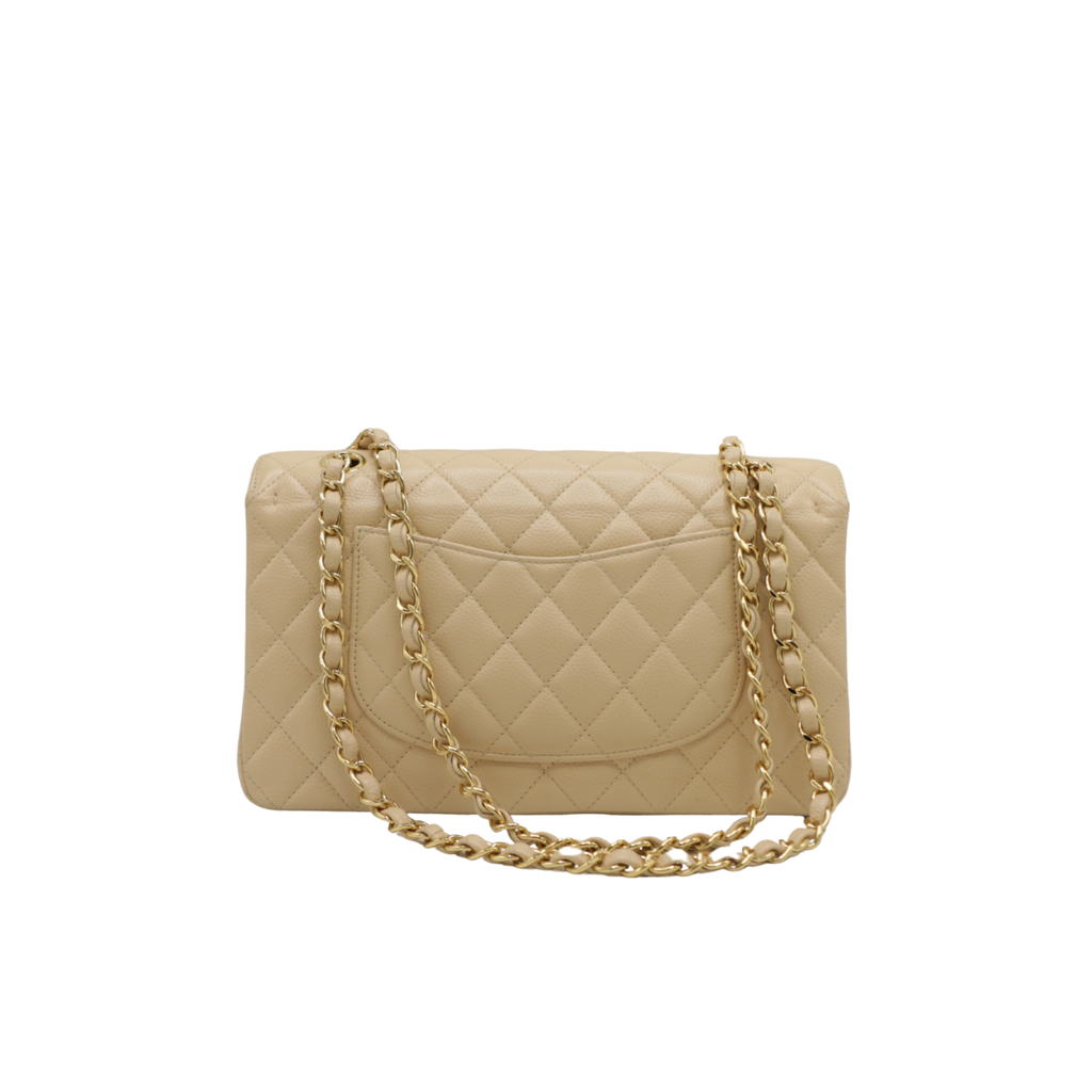 Chanel Medium Classic Double Flap bag crafted from caviar leather with beige gold-tone hardware