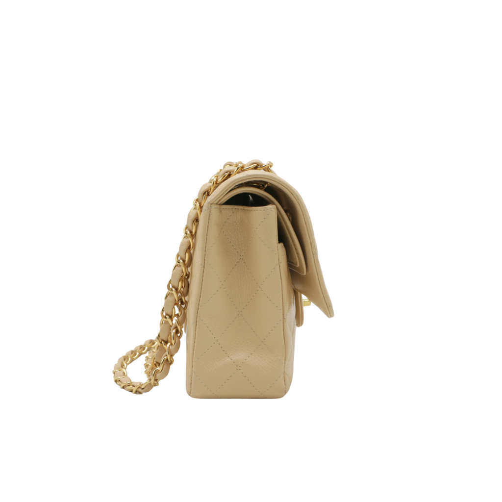 Chanel Medium Classic Double Flap bag crafted from caviar leather with beige gold-tone hardware