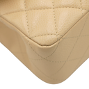 Chanel Medium Classic Double Flap bag crafted from caviar leather with beige gold-tone hardware