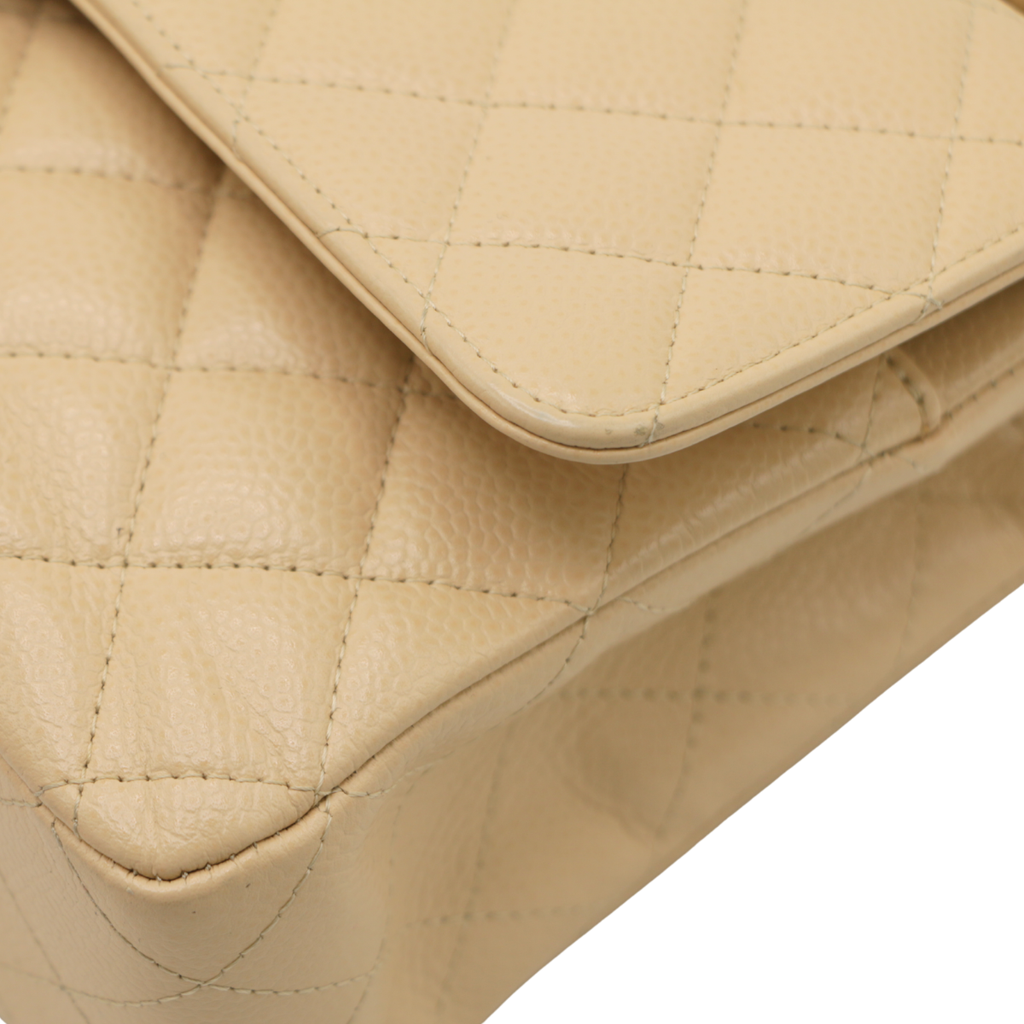 Chanel Medium Classic Double Flap bag crafted from caviar leather with beige gold-tone hardware