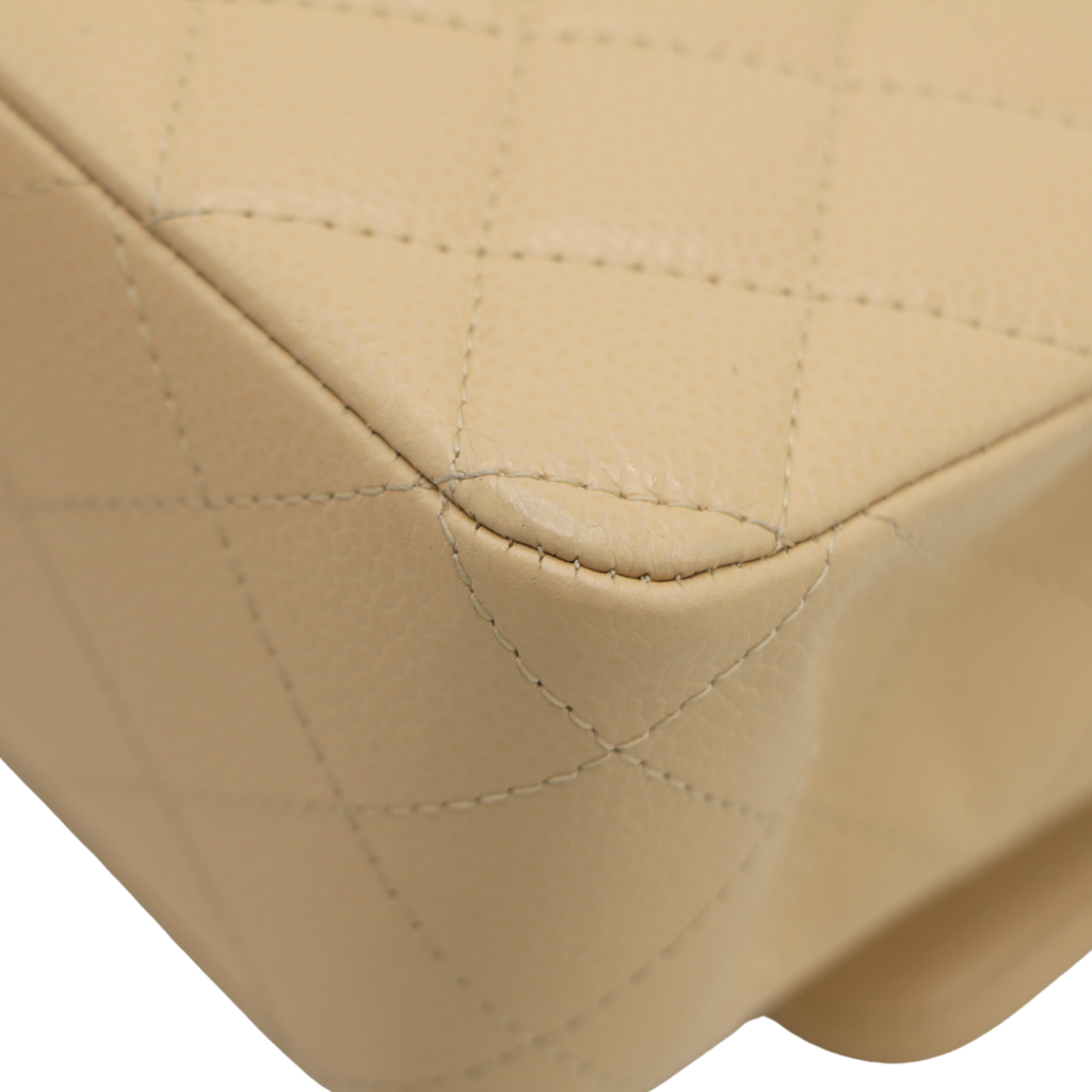 Chanel Medium Classic Double Flap bag crafted from caviar leather with beige gold-tone hardware