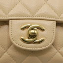 Chanel Medium Classic Double Flap bag crafted from caviar leather with beige gold-tone hardware