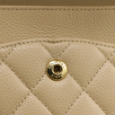 Chanel Medium Classic Double Flap bag crafted from caviar leather with beige gold-tone hardware