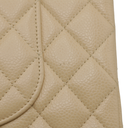 Chanel Medium Classic Double Flap bag crafted from caviar leather with beige gold-tone hardware