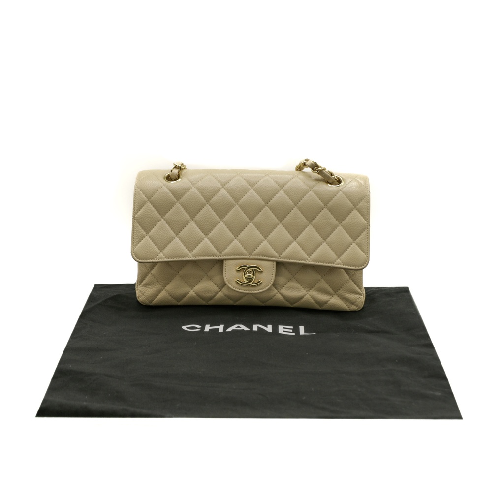 Chanel Medium Classic Double Flap bag crafted from caviar leather with beige gold-tone hardware