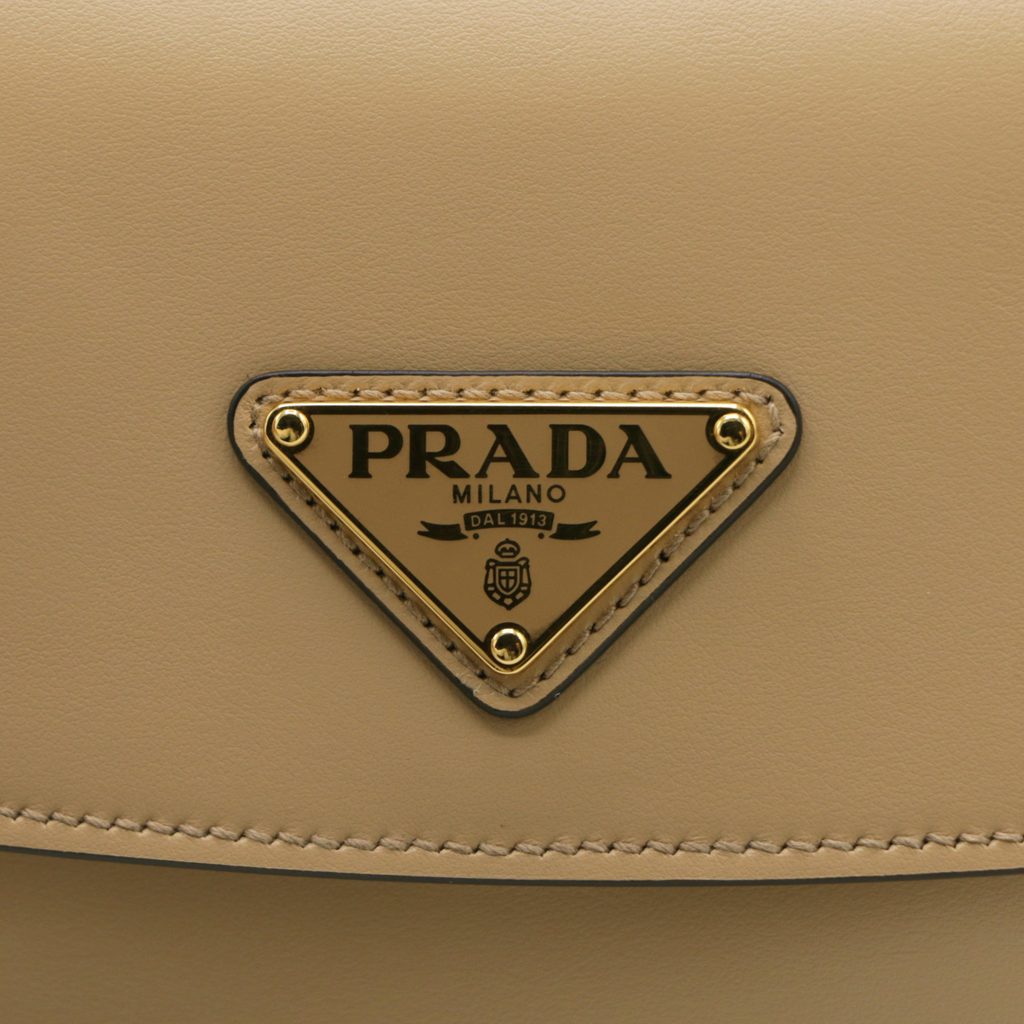 Prada Arqué leather shoulder bag with flap Camel
