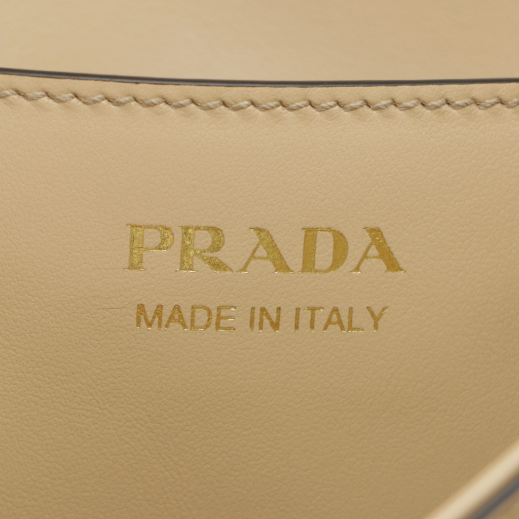 Prada Arqué leather shoulder bag with flap Camel