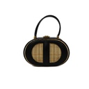 Christian Dior Wicker CD Vanity Bag crafted from black leather and natural wicker