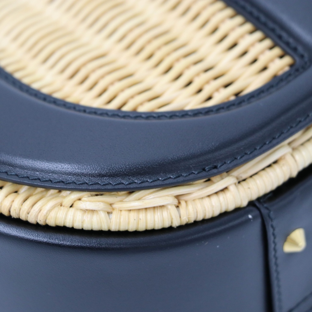 Christian Dior Wicker CD Vanity Bag crafted from black leather and natural wicker