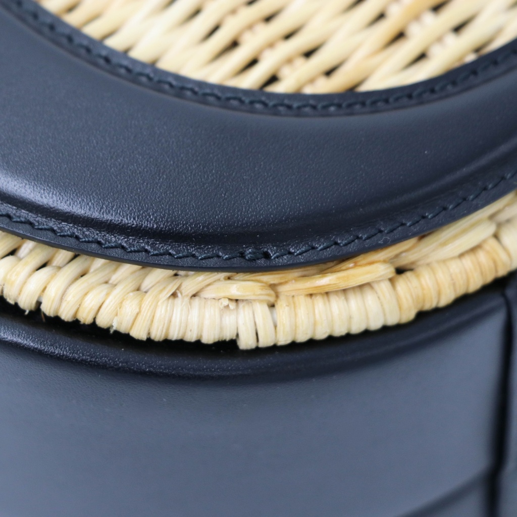 Christian Dior Wicker CD Vanity Bag crafted from black leather and natural wicker