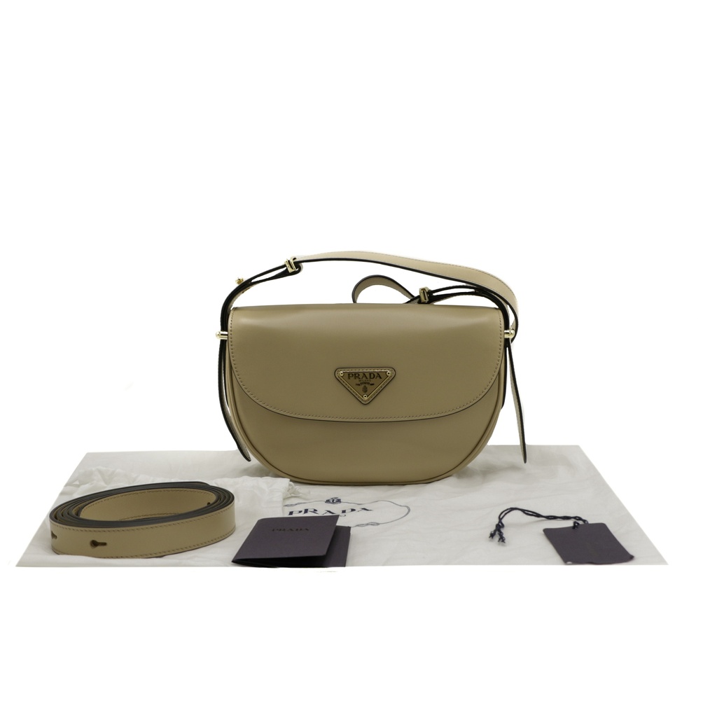 Prada Arqué leather shoulder bag with flap Camel